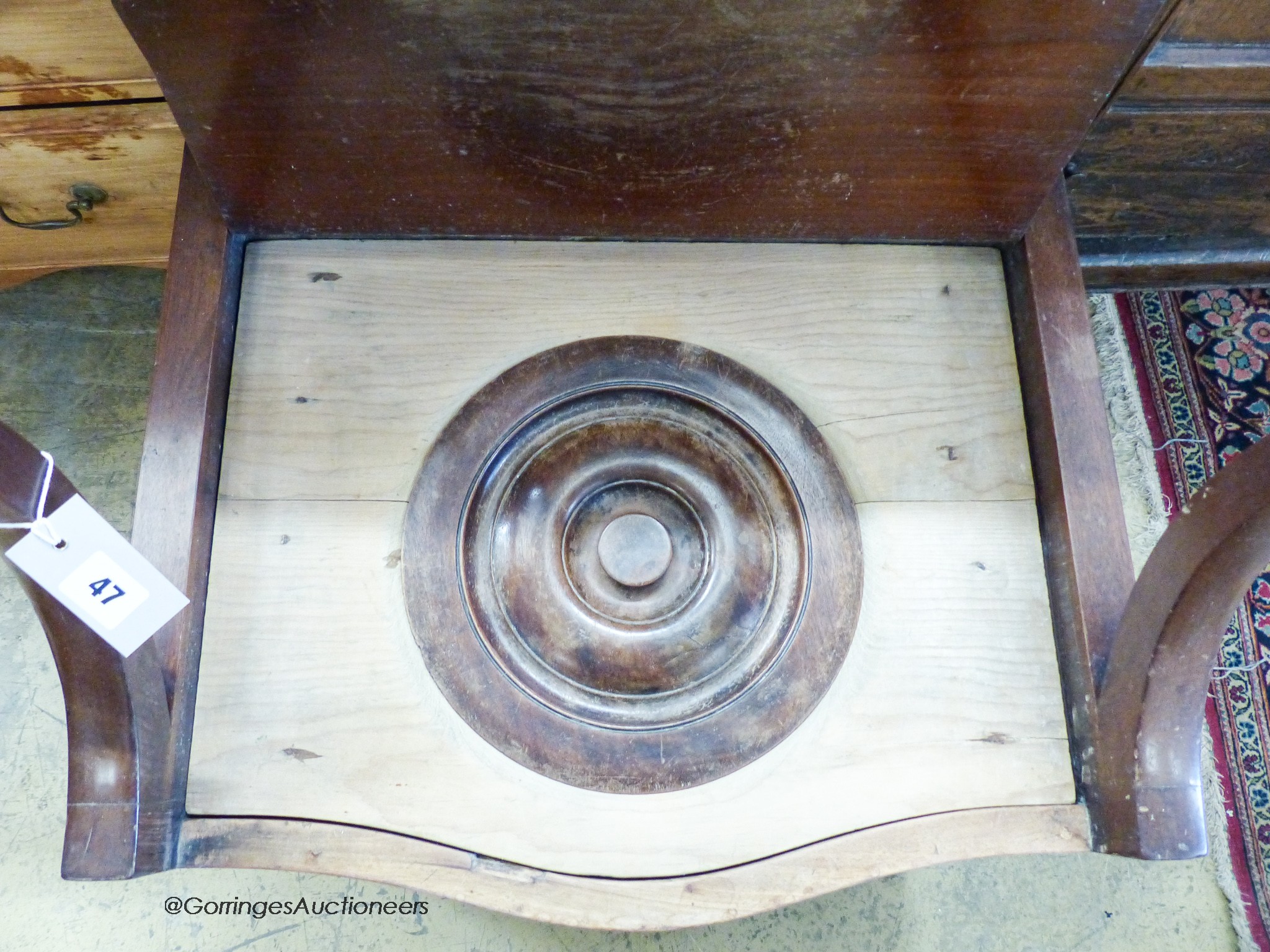 A George III mahogany serpentine front commode, width 58cm, depth 49cm, height 52cm